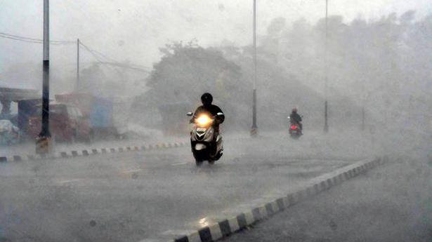 A two-wheeler rider braves heavy rain in Thiruvananthapuram on May 15, 2021.