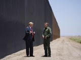 President Donald Trump speaks with Rodney Scott, the U.S. Border Patrol Chief, as he tours a section of the border wall, Tuesday, June 23, 2020, in San Luis, Ariz. (AP Photo/Evan Vucci)