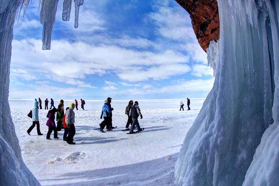 people walking on frozen lake