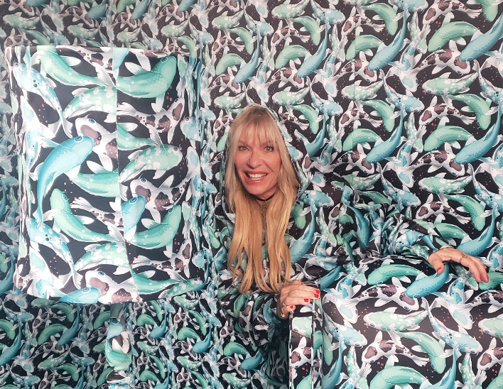 Patti in room matching her outfit
