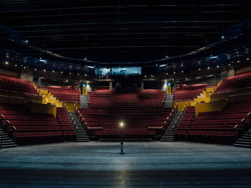 A single ghost light in the centre of Quarry Theatre stage