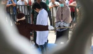 Indonesia: 14 men, including a Buddhist, flogged with a cane for relationships with women