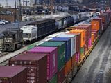 FILE - In this April 2, 2021, file photo train consists are formed at Norfolk and Southern Railroad&#39;s Conway Yard in Conway, Pa. Even as railroads are operating longer and longer freight trains that can stretch for two miles or more, the companies have drastically reduced staffing levels, prompting unions to warn that moves meant to increase profits could endanger safety and even result in disasters. (AP Photo/Gene J. Puskar, File)