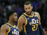 Utah Jazz center Rudy Gobert (27) talks with guard Donovan Mitchell, left, during the second half of an NBA basketball game against the Detroit Pistons Saturday, March 7, 2020, in Detroit. (AP Photo/Duane Burleson)