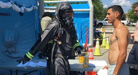 Photo of patient being decontaminated