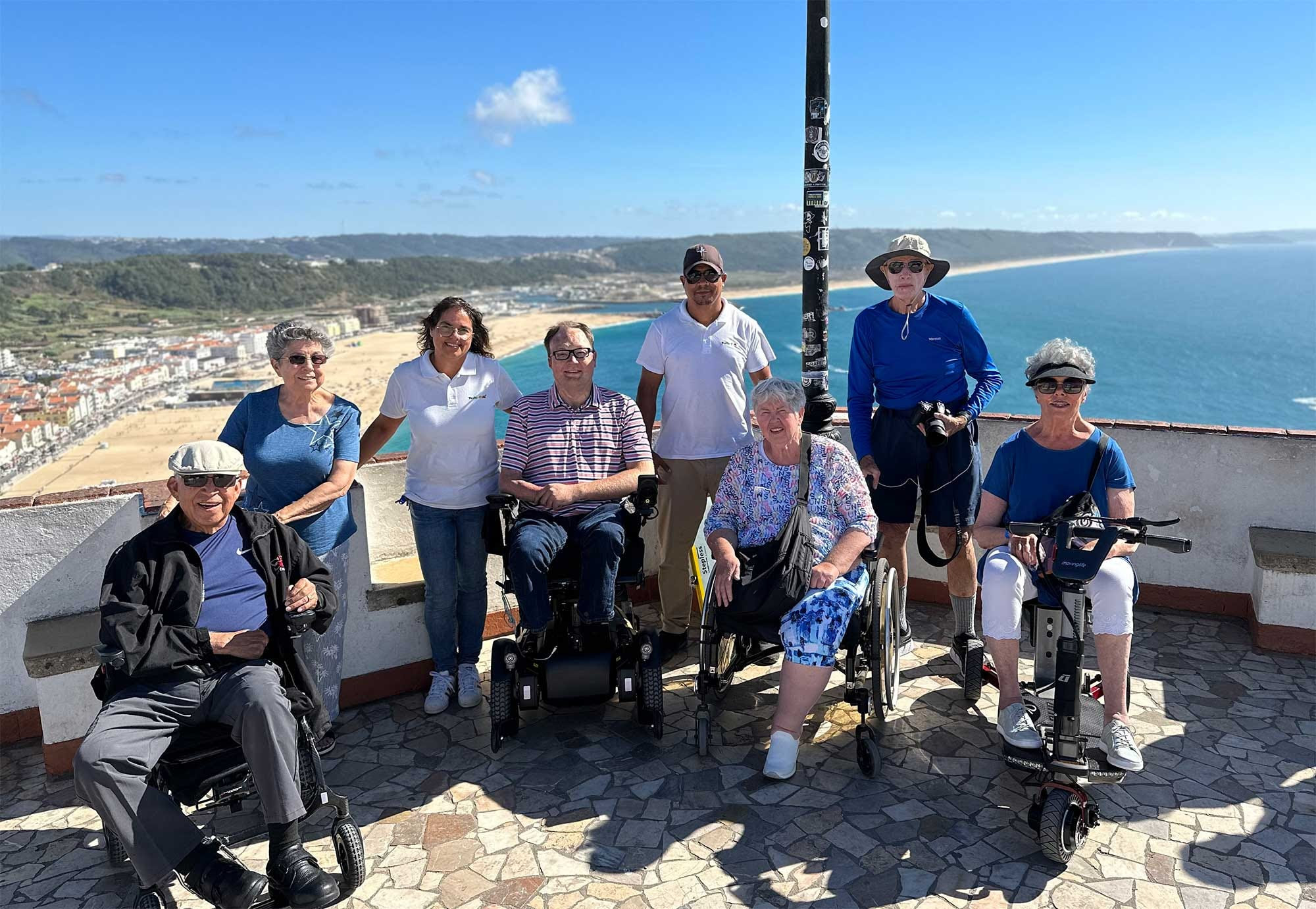 Group photo overlooking the white sandy beach with beautiful blue water. Group photo overlooking the white sandy beach with beautiful blue water.