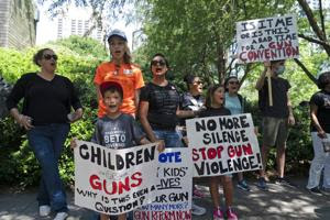 NRA meets in Texas amid protests after school massacre