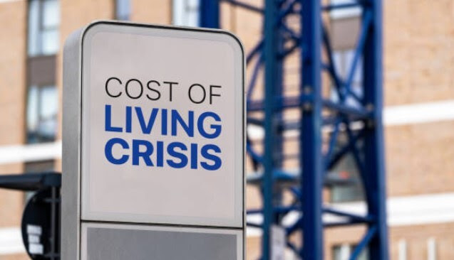 image of signage saying cost of living crisis