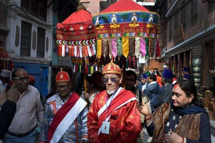 Two days before the festival, elders from the <i>vihara</i> walk through Patan inviting communities to participate. From kathmandupost.com