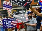 Supporters of of President Donald Trump hold signs during a rally at Pliny Park in Brattleboro, Vt., Saturday, June 27, 2020. (Kristopher Radder/The Brattleboro Reformer via AP)