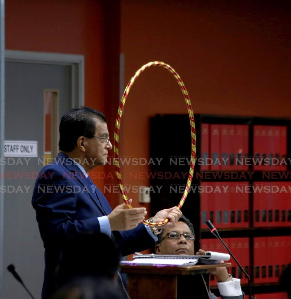 Ramesh Lawrence Maharaj, SC, lead counsel to the Paria Commission of enquiry, holds a ring similar in diameter to that of the 36-inch pipeline that five divers were working during a hearing on November 11, 2022. Four divers died on February 25, 2021. -