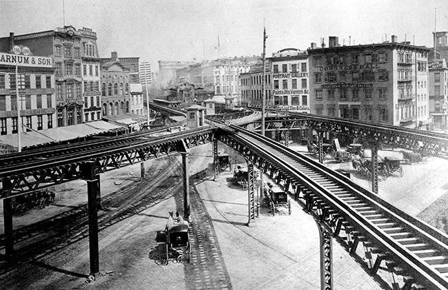 This is an 1878 view of the Third Avenue Line El train tracks, looking north up the east side of the Bowery, at Chatham Square in lower Manhattan, New York. (AP Photo)