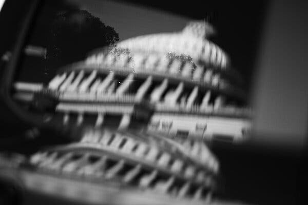 A distorted image in black and white of the U.S. Capitol.