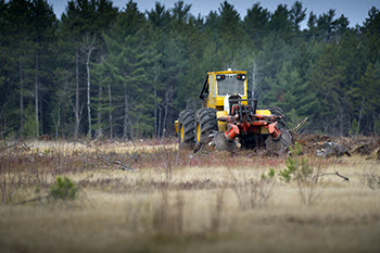 trencher prepares soil for planting