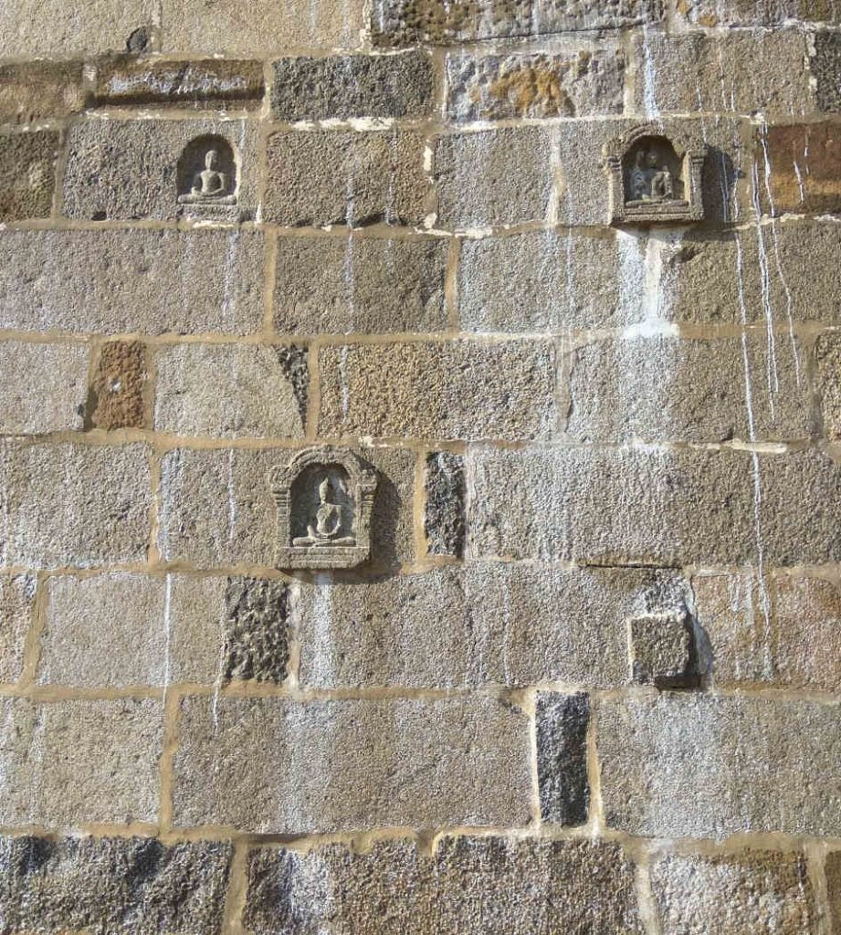 Buddha images in the compound wall of Ekambareswarar Temple, Kanchi.