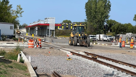 construction equipment near LRT station and train tracks
