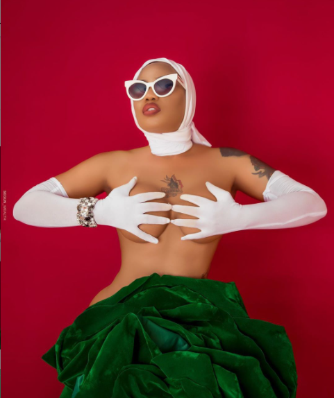 Toyin Lawani barely covers her naked body with a giant green flower to celebrate Nigeria
