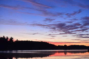 Sunrise is shown over Deer Lake in Marquette County one of Michigan's recovered Areas of Concern.