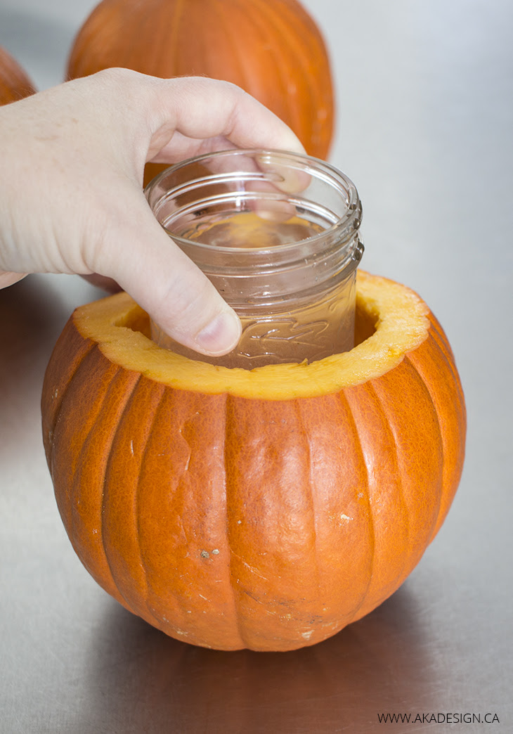 Place mason jar of water in pumpkin