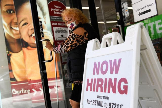 A &#39;now hiring&#39; sign is displayed outside of a Burlington Coat Factory retail store on March 11, 2022 in downtown Los Angeles, California. - US consumer prices hit a new 40-year high in February 2022 as the world&#39;s largest economy continued to be battered by a surge of inflation, which the fallout from Russia&#39;s invasion of Ukraine is expected to worsen. (Photo by Patrick T. FALLON / AFP) (Photo by PATRICK T. FALLON/AFP via Getty Images)