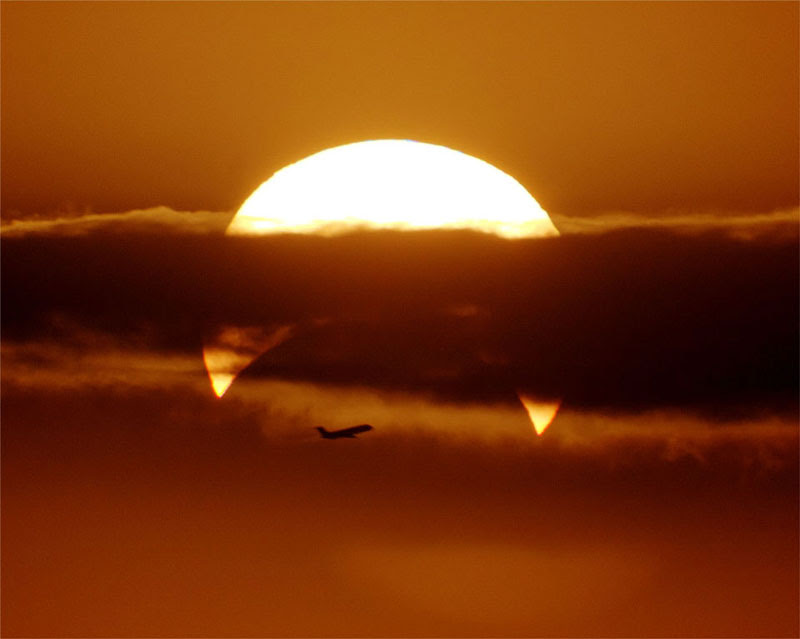 http://twistedsifter.com/2013/06/flyby-partial-solar-eclipse/