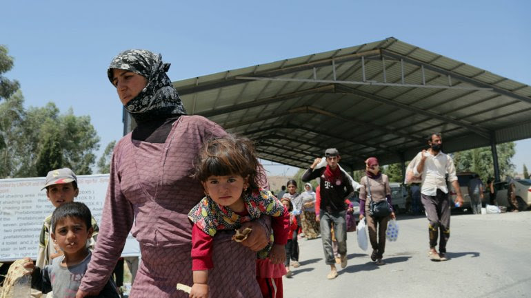 niños huyen de Irak
