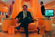 Billionaire Saudi prince Alwaleed bin Talal on his airplane throne, sitting under the logo of his company. Alwaleed has no confidence in Obama when it comes to Iran.