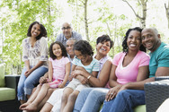 Multi-generation African Americanfamily sitting outside