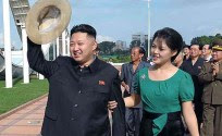 Kim Jong Un (Left)