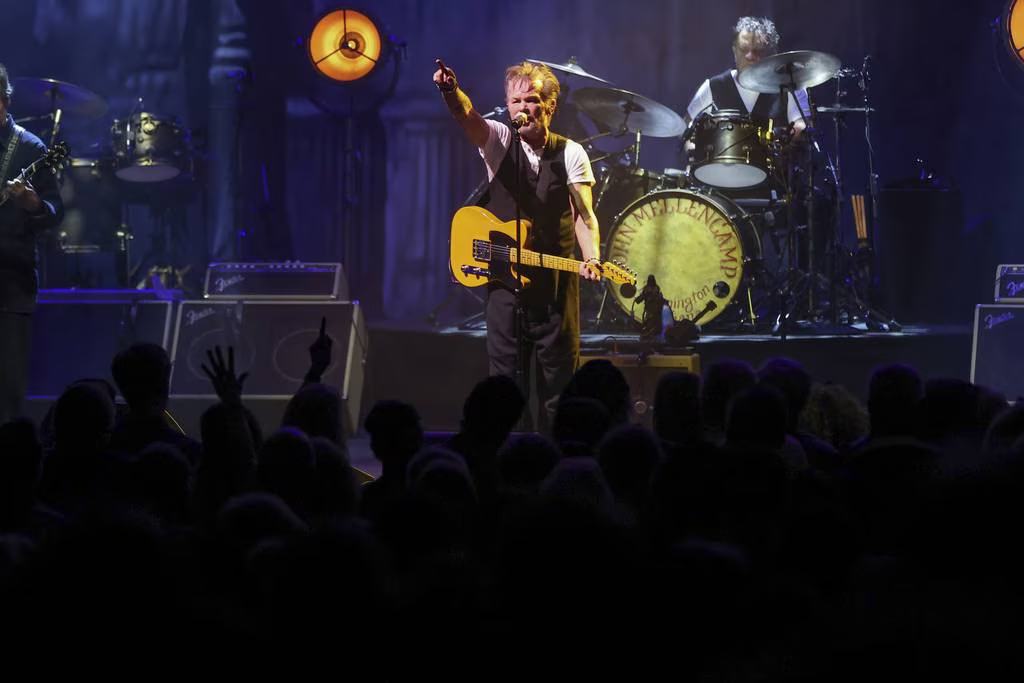 John Mellencamp interacts with fans at Chicago Theatre at the April 13, 2023 show in Chicago. 