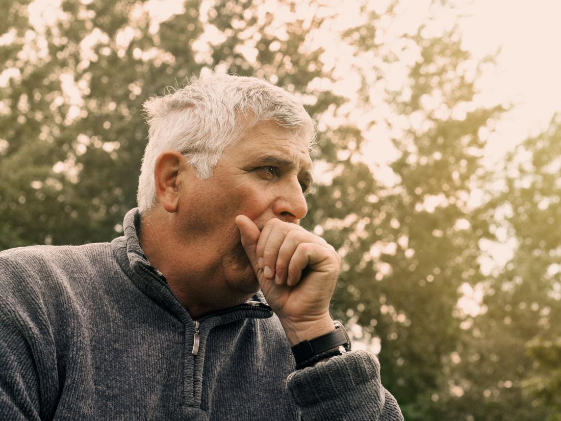 a man with a cough because of lung cancer