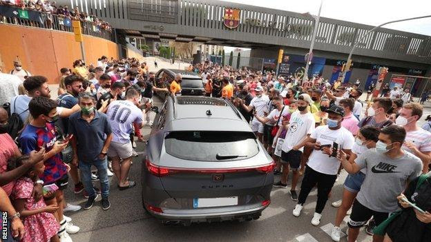 Fans gathered outside the Nou Camp for Lionel Messi's news conference on 8 August 2021