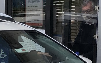 Photo of Plexiglas sneeze guard on toll booth at Fauntleroy terminal