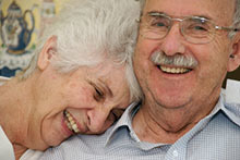 Smiling older couple.