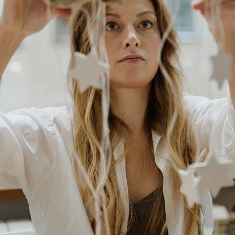 Woman handing craft stars
