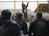 Central American immigrants hang around by the fence line of a shelter guarded by Mexican Federal police in riot gear in Piedras Negras, Mexico, Tuesday, Feb. 5, 2019. A caravan of about 1,600 Central American migrants camped Tuesday in the Mexican border city of Piedras Negras, just west of Eagle Pass, Texas. The governor of the northern state of Coahuila described the migrants as &amp;quot;asylum seekers,&amp;quot; suggesting all had express intentions of surrendering to U.S. authorities. (Jerry Lara/The San Antonio Express-News via AP) **FILE**