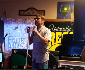 Joseph on stage as a comedian after his peripheral vision loss