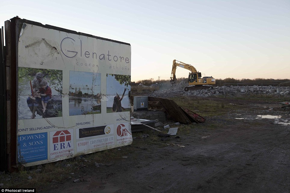 Bulldozed: The last remaining units on the Glenatore Esate in Athlone, Ireland, where in 2012 a two-year-old boy was killed after breaking through a fence onto an unfinished development, are being torn down