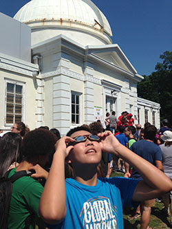 boy watching eclipse