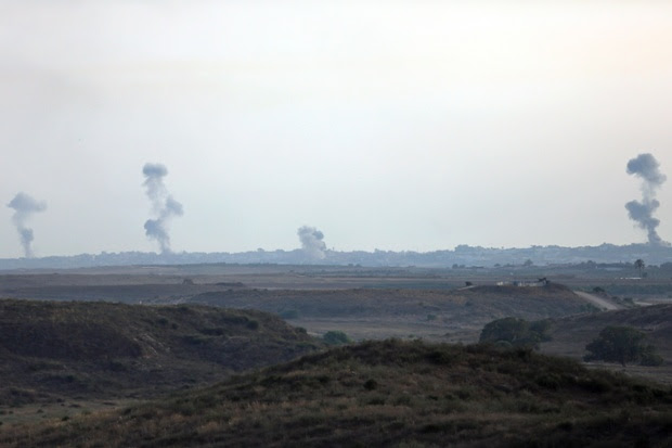 Smoke rises following Israeli strikes on Gaza, seen from the Israel-Gaza border.