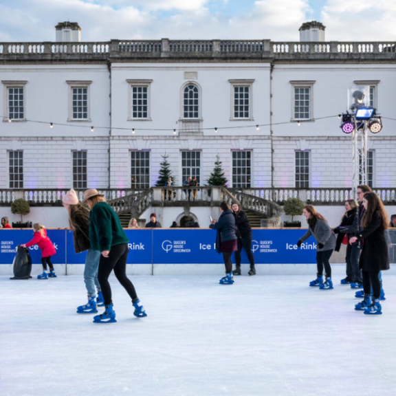 People ice skating in front of Queen's House