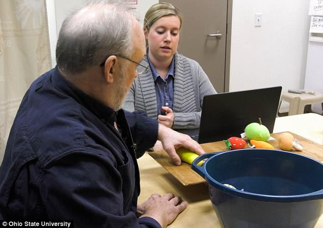 While the stimulator is switched on, Ken has to practice repetitive movements in therapy