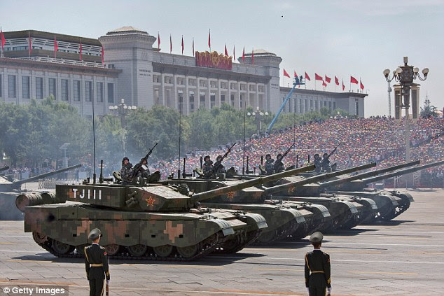 Chinese soldiers ride in tanks as they pass in front of Tiananmen Square and the Forbidden City during a military parade. Although India is still poorer and weaker than both the US and China, within the next 20 years India will possess the world’s third largest economy and military.
