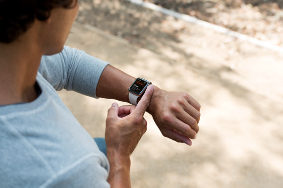 Customer taking an ECG reading with Apple Watch Series 4.