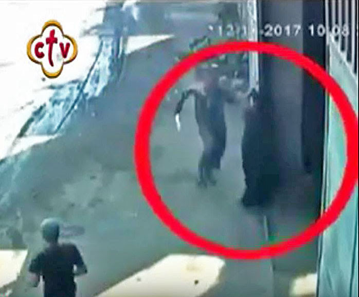  Assailant arriving at warehouse door in pursuit of Coptic Orthodox bishop on outskirts of Cairo, Egypt. (Screen grab of security footage)