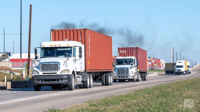 Heavy duty trucks spew out pollution on road
