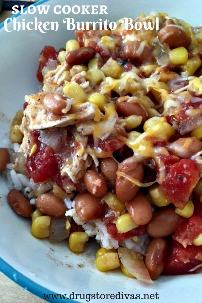 Beans, rice, chicken, corn, and onions in a bowl with the words "Slow Cooker Chicken Burrito Bowl" digitally written above it.
