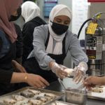 Students prepare scones at Michael Berry Career Center during a summer 2021 class.