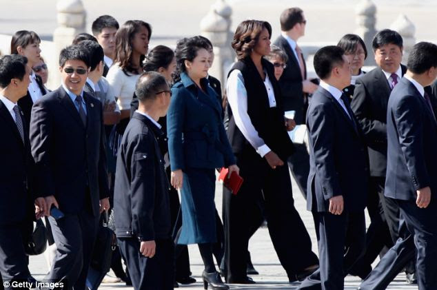 Can you spot the Secret Service? Many of the agents in Mrs. Obama's detail are Asian-American, helping them avoid standing out while they protect the first lady -- but confusing some hotel guests who don't understand why they can't board some elevators