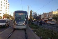 Jerusalem Light Rail traveling through a neighborhood in the capital.